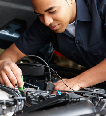 Man Working Under a Car's Hood for Auto Electric Repair in Manassas, VA